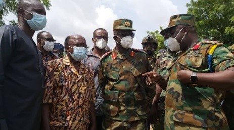 Image courtesy of Graphic Online: Major General Emmanuel Kotia and Mr Douti Lardja being briefed on the border dispute