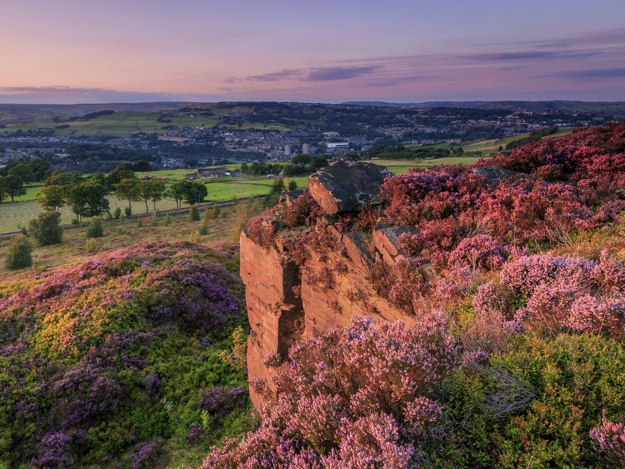 Yorkshire Sunset on rocks and fields in the distance