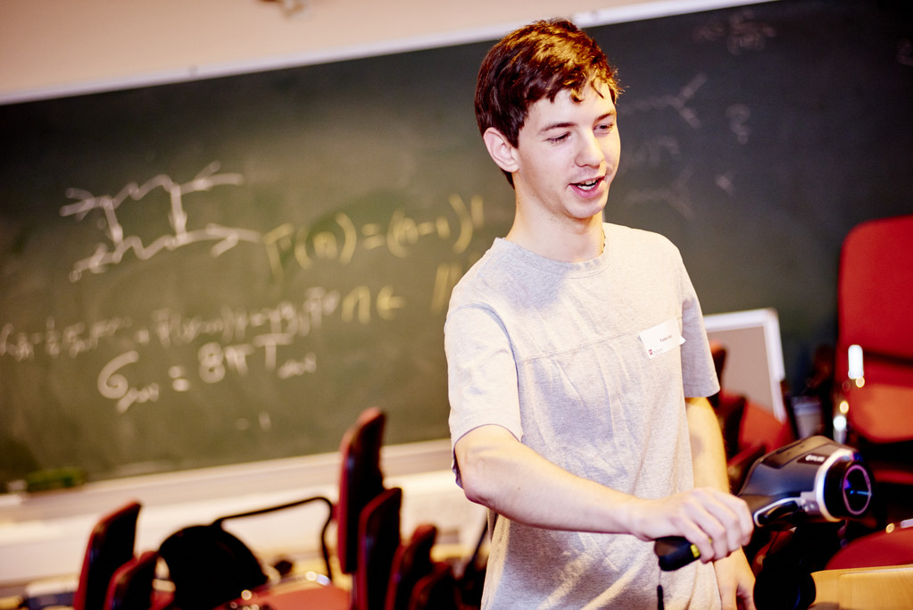 Student in front of chalkboard