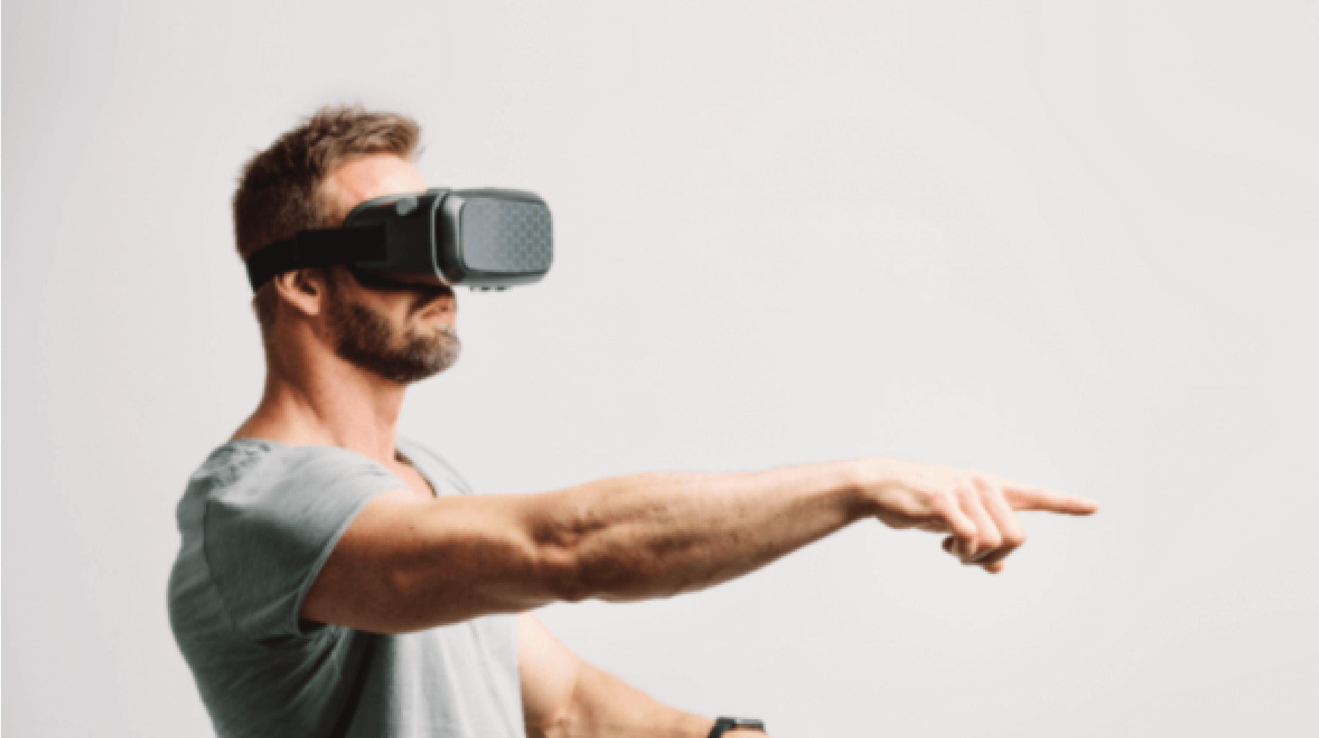 Man wearing virtual reality headset and pointing