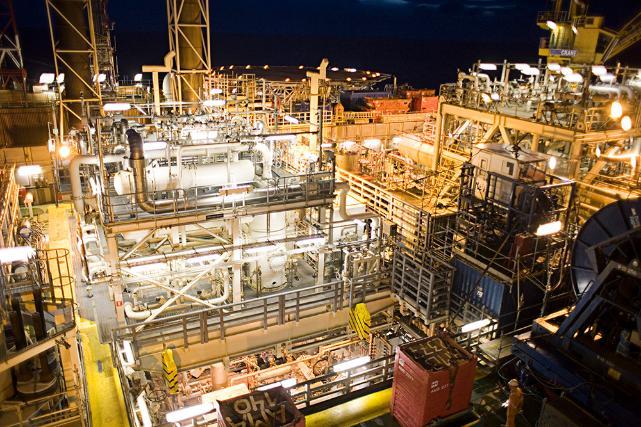 An oil rig platform at night