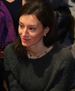 Profile picture of Marta Cenedese (a young medium-skinned woman with mid-length dark hair wearing a dark green knitted jumper)