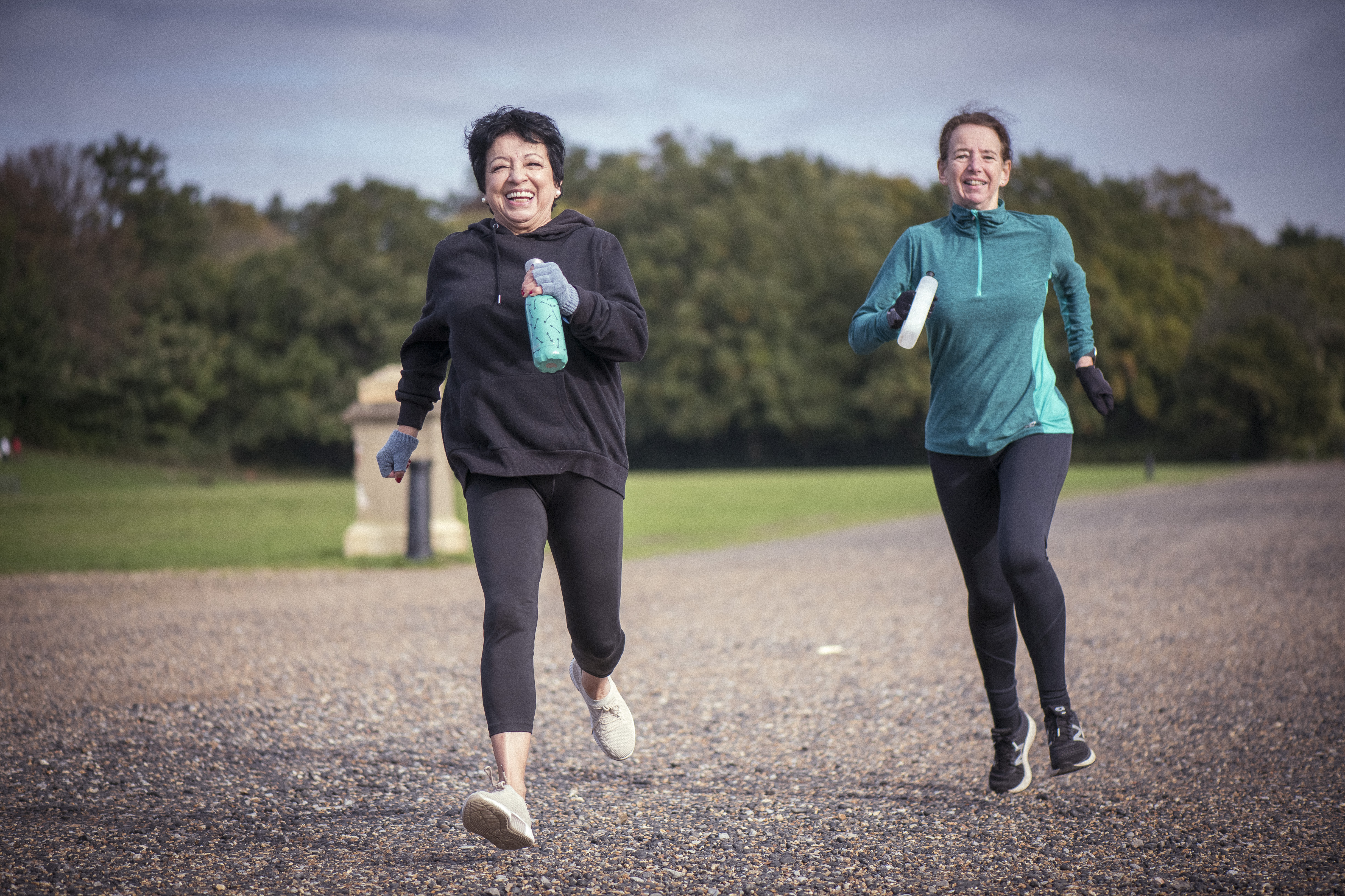 Pair of older women running.