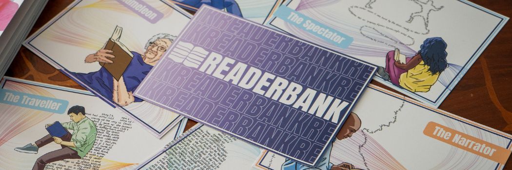 RedaerBank postcard sits on other postcards