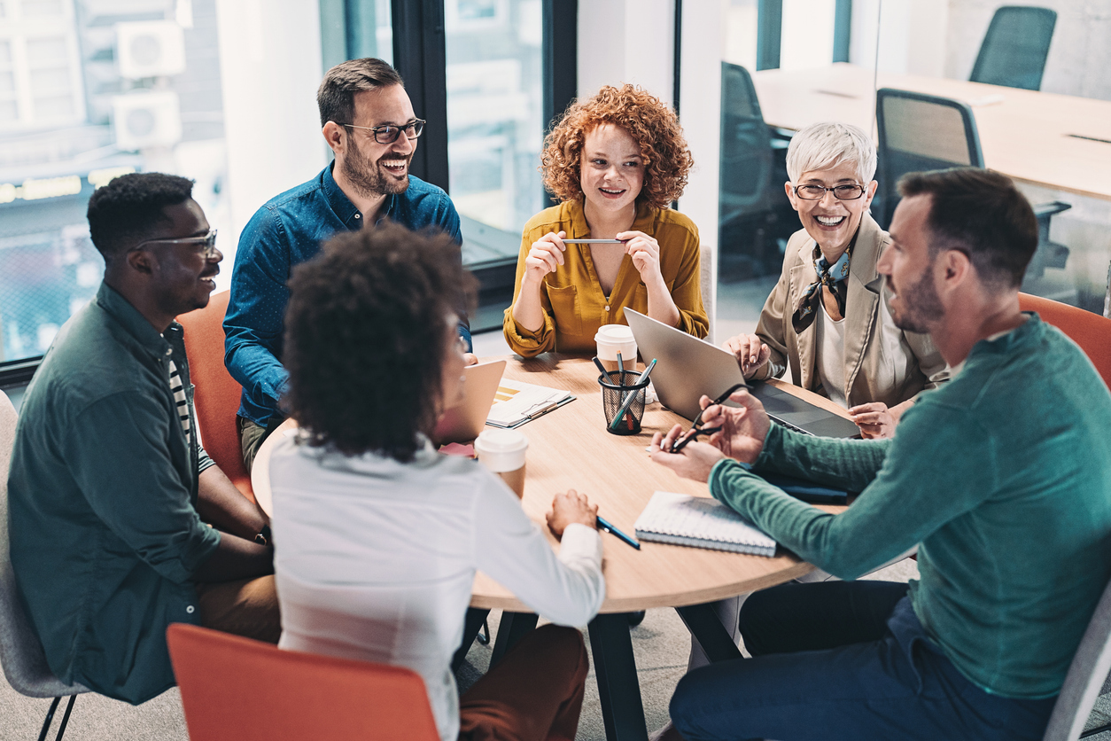 Group of researchers sat around a table