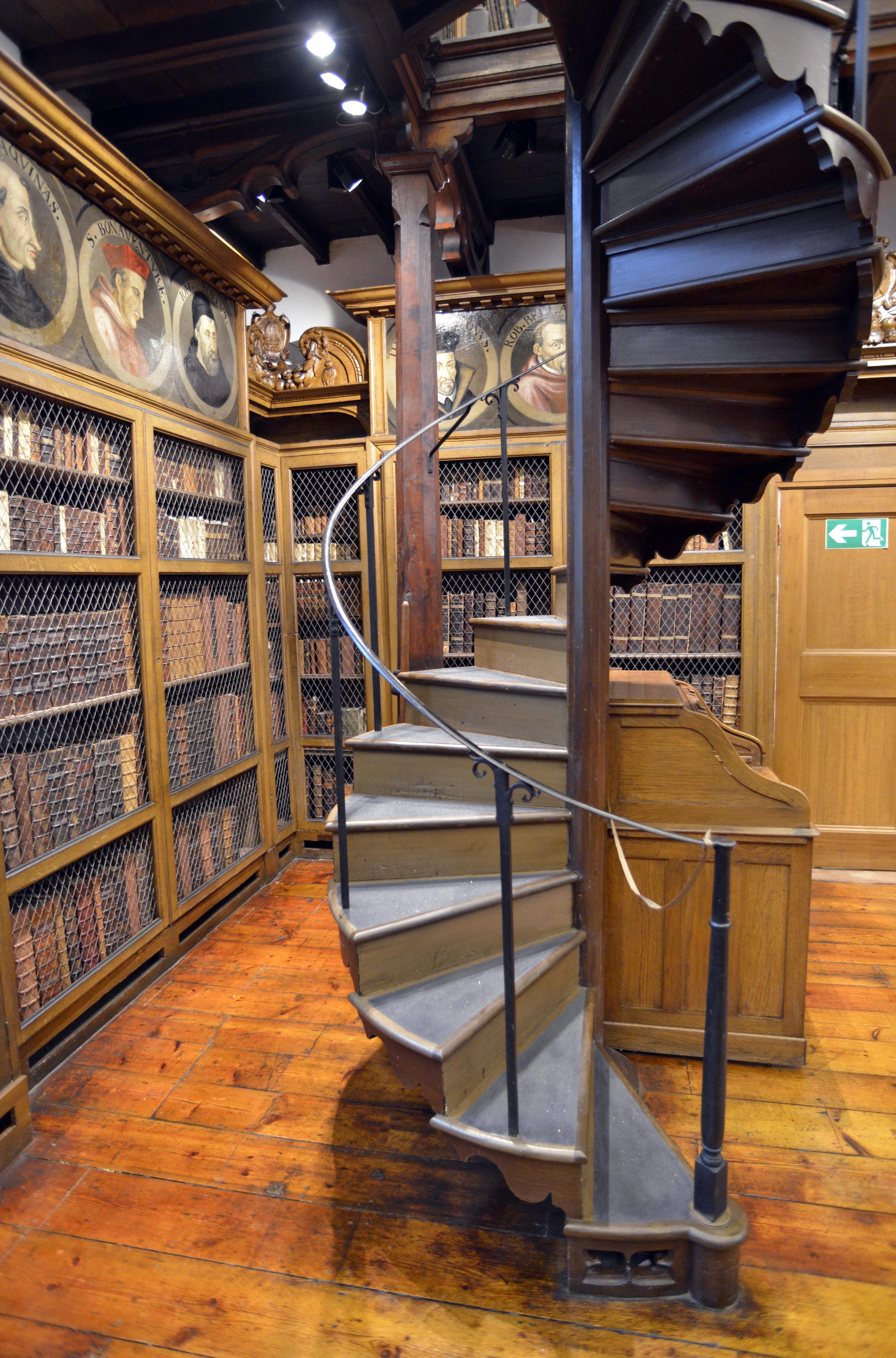 A library with a large staircase in the middle