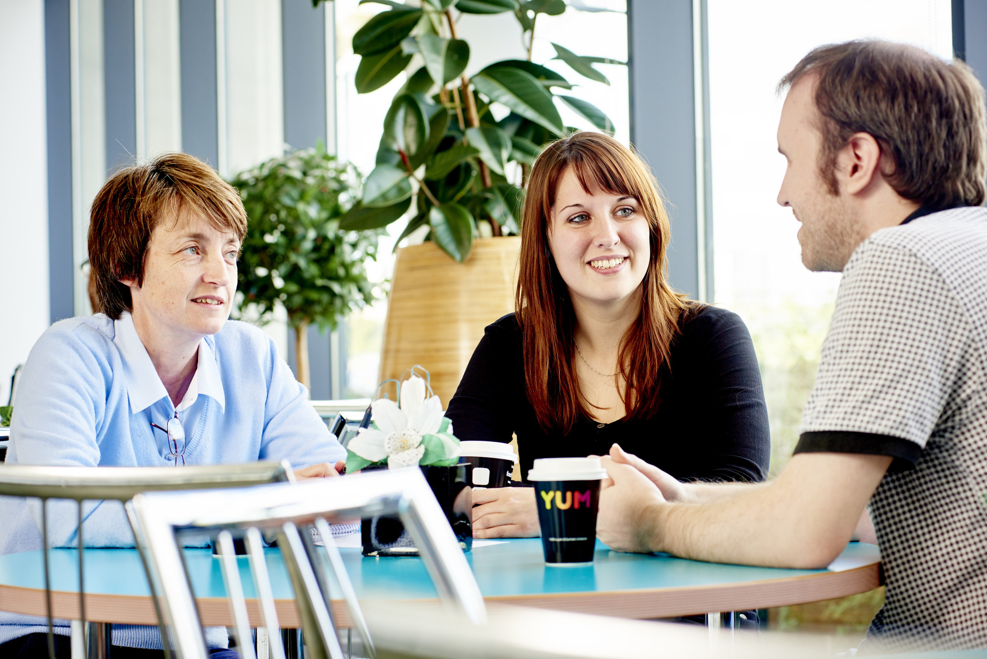 Three people talking