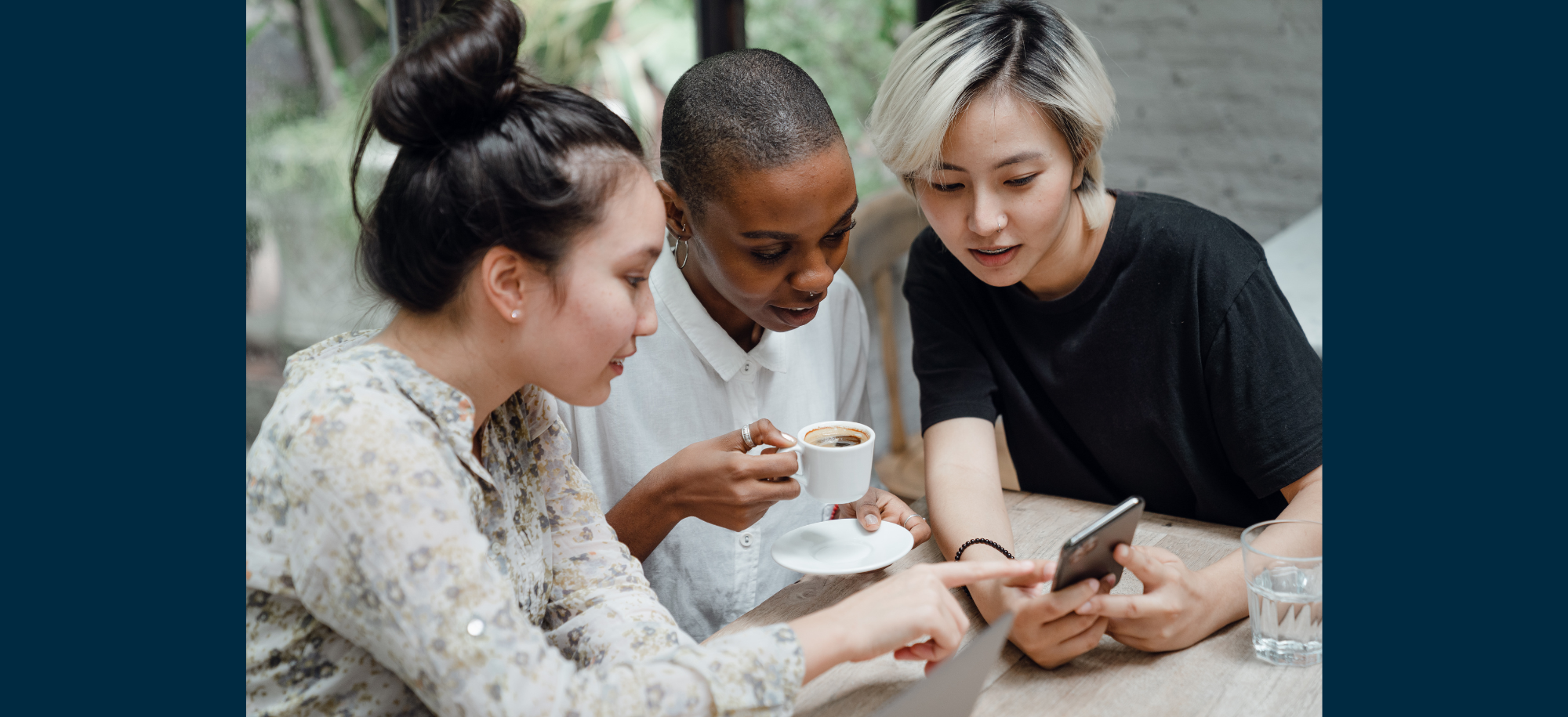 women looking at a phone