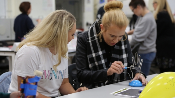 Teachers exploring electricity circuits