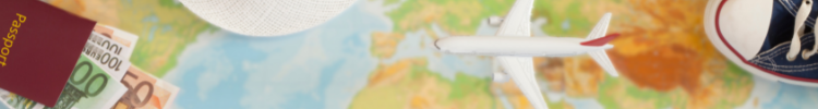 World map with plastic aeroplane, shoe, passport and Euros