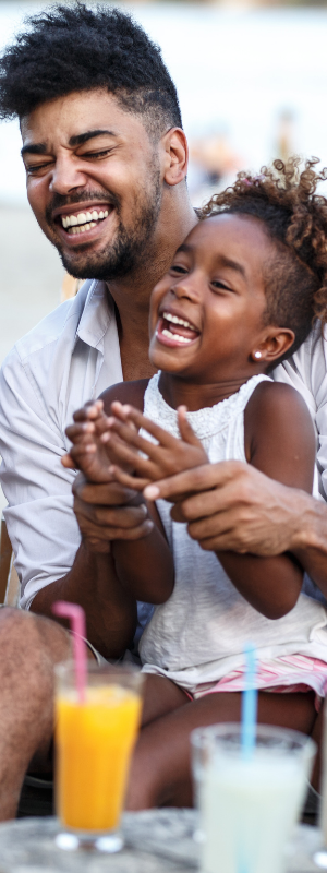 Father holding his daughter