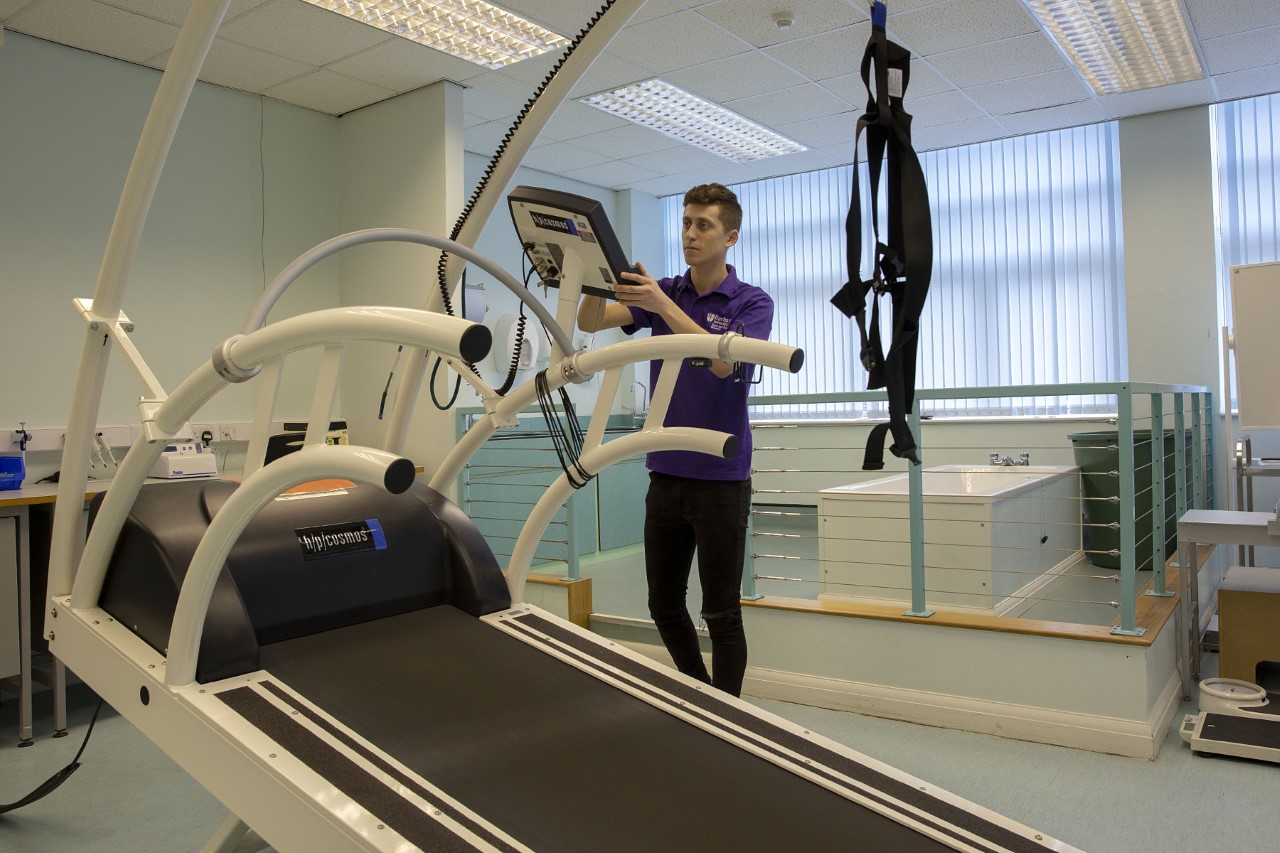 TA technician adjusting the settings on sports equipment