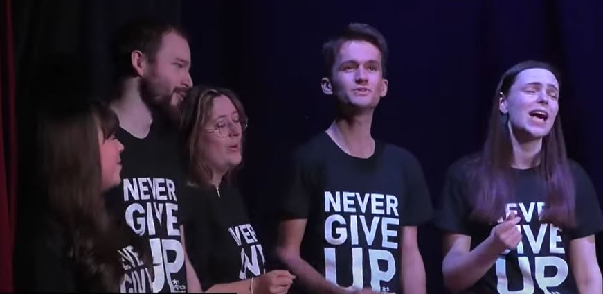 Students from the group Foot Notes singing at Never Give Up