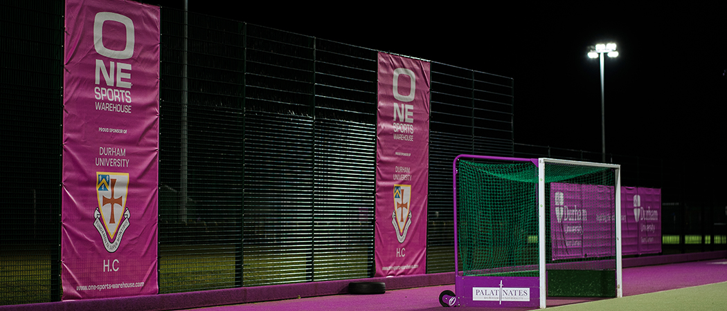 ONE Sports Warehouse signage around a Durham Hockey Pitch