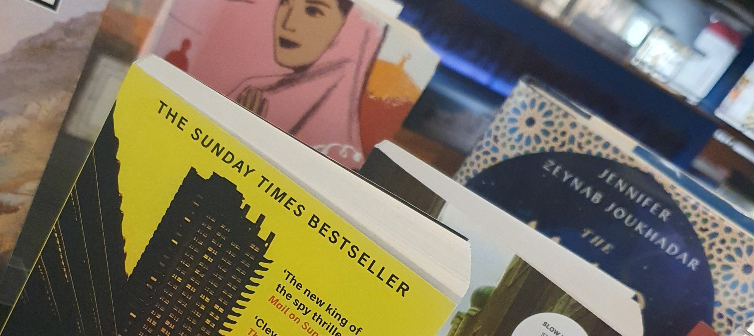 Image of books standing in from of the Oriental Museum gallery displays