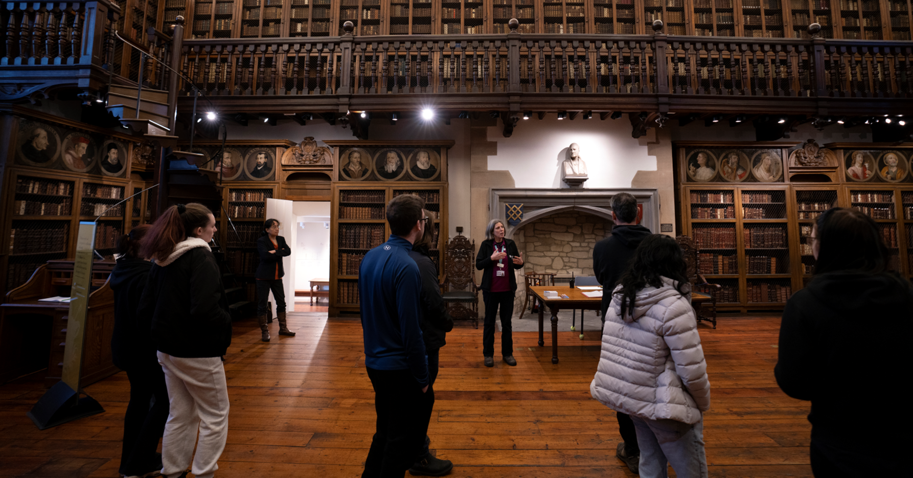 Tour guide giving a tour to a group of people in the Bishop Cosin's Historic Library