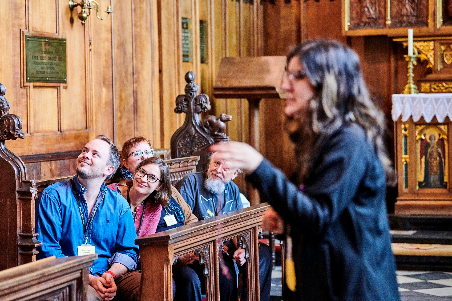 A Durham Castle tour guide leading a tour